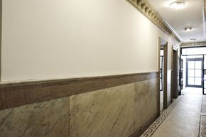 New York apartment for rent - the lobby of the building has a long wall with wood trim