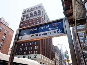 New York apartment for rent - a street sign for 23rd street and path trains in the city