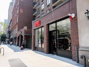 New York apartment for rent - a street view of a store in a city