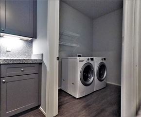 East Lansing apartment for rent - a laundry room with a washing machine and a dryer