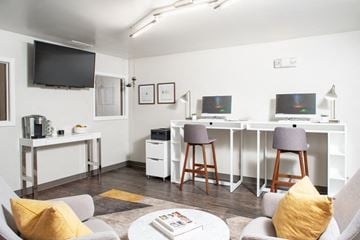 Bellevue apartment for rent - a living room with a couch and a table with two stools