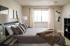 Bellevue apartment for rent - a bedroom with a large bed and a window