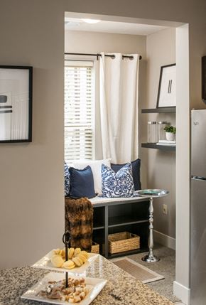 Bellevue apartment for rent - a small dining room with a table and a chair and a window with white curtains