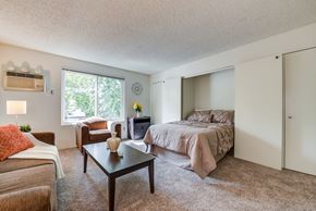 Studio City apartment for rent - a bedroom with a bed and a couch and a coffee table