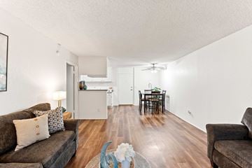 Northridge apartment for rent - A living room with a brown couch and a coffee table.