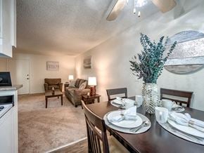 Northridge apartment for rent - a dining room table with a vase of flowers