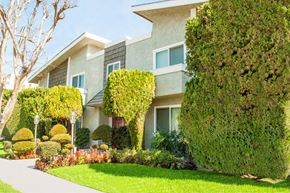 Sherman Oaks apartment for rent - a house with a lawn and a sidewalk in front of it