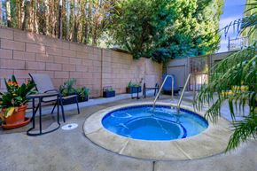 North Hollywood apartment for rent - a small pool in the backyard of a home with a hot tub