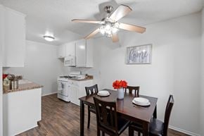 Studio City apartment for rent - Kitchen with appliances such as gas range and microwave with an open concept dining room. Ample storage and plank flooring.