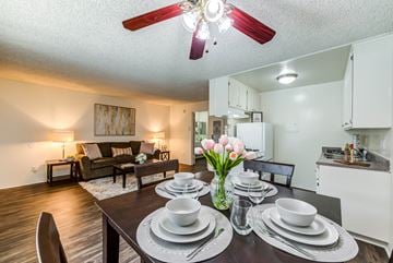 Tarzana apartment for rent - a living room with a dining room table and a ceiling fan