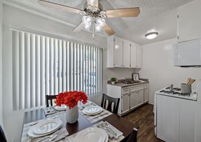 Van Nuys apartment for rent - A kitchen with a table set for a meal.