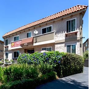 Van Nuys apartment for rent - a building with a sign on the side of it
