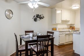 Lake Balboa apartment for rent - a dining area with a table and chairs and a kitchen