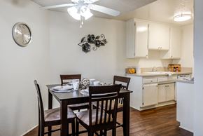 Lake Balboa apartment for rent - a dining room with a table and chairs and a kitchen