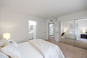 Sherman Oaks apartment for rent - a bedroom with a large bed and a mirror