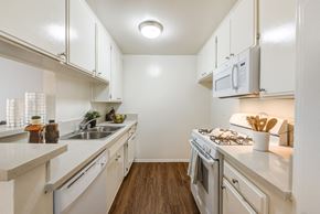 Sherman Village apartment for rent - Kitchen with upgraded counter tops and appliances at the Plaza Apartments in Sherman Village