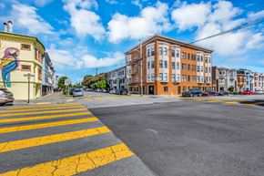 San Francisco apartment for rent - A street view with a crosswalk and buildings on either side.