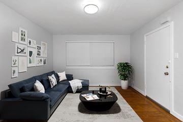 San Francisco apartment for rent - A living room with a black couch and a coffee table.