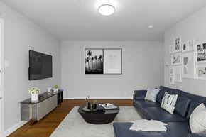 San Francisco apartment for rent - A modern living room with a grey sofa and a coffee table.