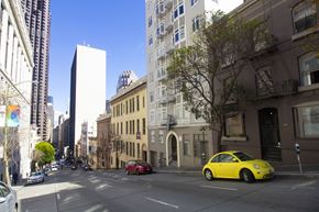 San Francisco apartment for rent - A yellow car is parked on the side of a street.