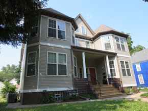St. Paul apartment for rent - A two-story house with a red door and white trim.