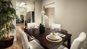 Camarillo apartment for rent - a dining room with a wooden table and white chairs