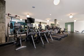 Camarillo apartment for rent - a gym with various cardio machines and weights