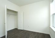 Little Egg Harbor apartment for rent - an empty bedroom with white walls and a closet with a door