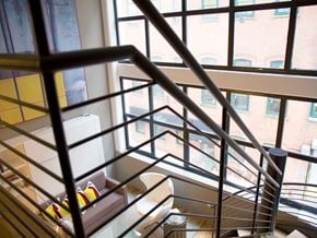 Yonkers apartment for rent - a stairwell with a view of a window and some stairs