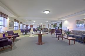 Elkins Park apartment for rent - a lobby with couches tables and chairs and a table in the middle