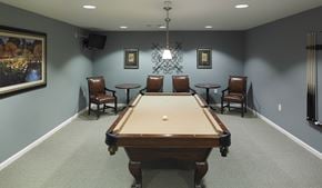Laurel apartment for rent - a game room with a pool table and chairs