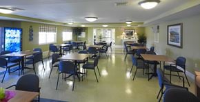 Laurel apartment for rent - a dining room with tables and chairs in a multipurpose room