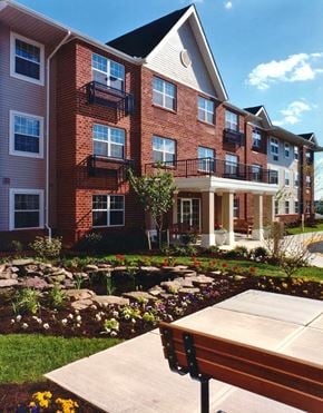 York apartment for rent - a large brick building with a sidewalk in front of it