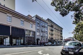 San Francisco apartment for rent - A black car is parked on the side of a street.