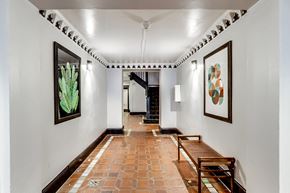 San Francisco apartment for rent - A hallway with a bench and pictures on the wall.