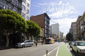 San Francisco apartment for rent - A city street with a green bike lane on the right side.