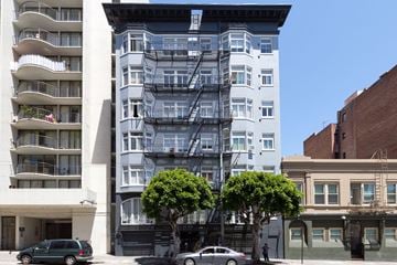 San Francisco apartment for rent - A white building with a fire escape on the side.
