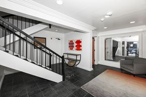 San Francisco apartment for rent - A black and white staircase leads to a second floor.