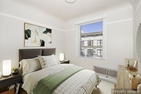 San Francisco apartment for rent - A bedroom with a bed, nightstand, and window.