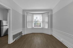 San Francisco apartment for rent - A room with a window and a radiator on the wall.