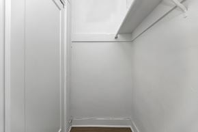 San Francisco apartment for rent - A white room with a door and a wooden floor.