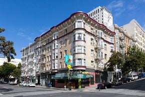 San Francisco apartment for rent - A street view of a city with a building in the middle.