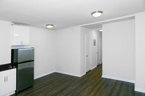 San Francisco apartment for rent - A kitchen with a refrigerator and cabinets.