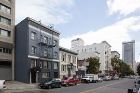 San Francisco apartment for rent - A street view of a city with cars parked on the side of the road.