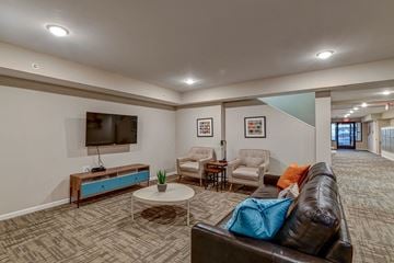 Columbus apartment for rent - a living room with a leather couch and a television