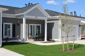 Muncy apartment for rent - a home with a patio and a tree in the yard