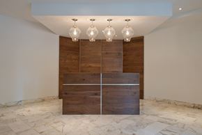 Washington apartment for rent - a large wooden wall with four lamps on top of it and a row of lights