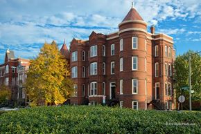 Washington apartment for rent - a large brick building with a tree in front of it