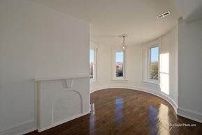 Washington apartment for rent - a living room with a fireplace and a wooden floor