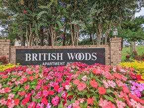 Nashville apartment for rent - the sign woods apartments is surrounded by flowers